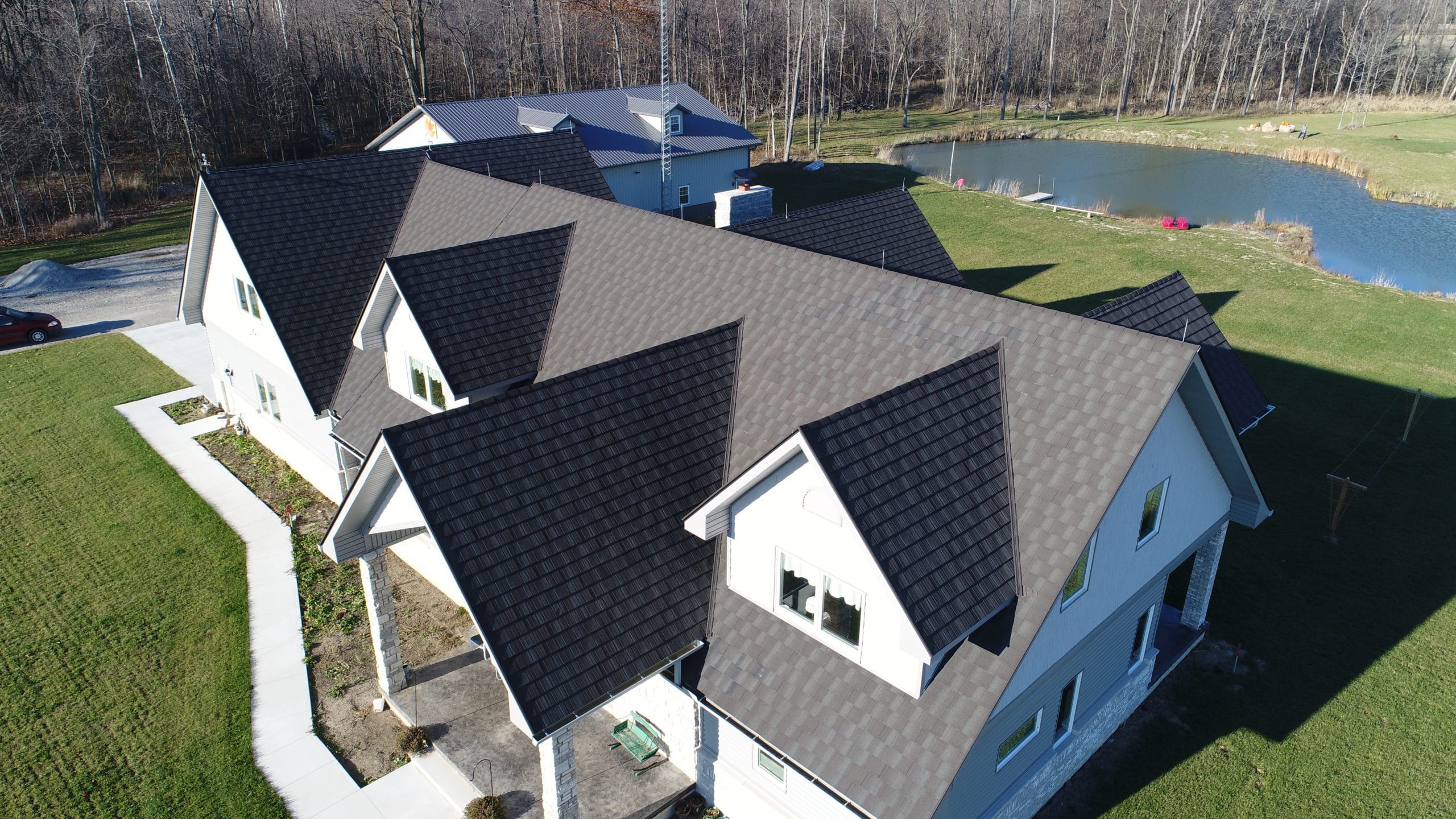 white house with stone coated metal shingles